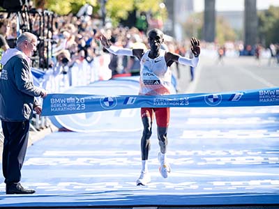 Eliud Kipchoge celebrates winning the BMW Berlin Marathon in 2023